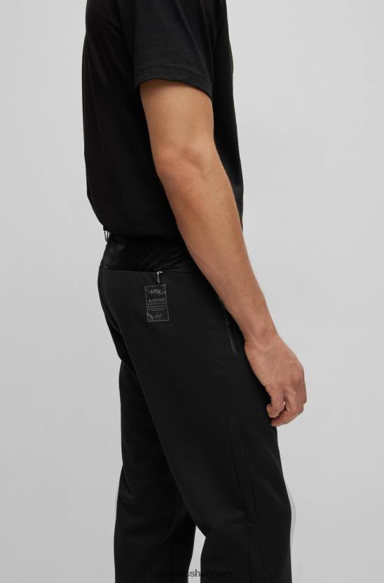 Hugo Boss x ajbxng vékony szabású, szabályosan emelkedő nadrág együttműködő márkajelzéssel 80P62728 fekete