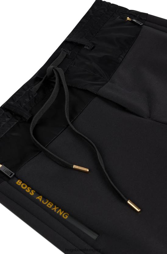 Hugo Boss x ajbxng vékony szabású, szabályosan emelkedő nadrág együttműködő márkajelzéssel 80P62728 fekete